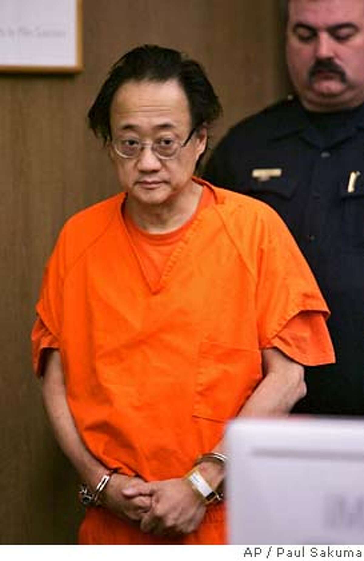 Norman Hsu is escorted into a Redwood City, Calif., courtroom, Friday, Sept. 21, 2007. Jilted investors who sunk $63 million into Hsu's alleged Ponzi schemes are competing for whatever financial crumbs they can shake from the disgraced Democratic fundraiser. At the same time, state and federal prosecutors are wrangling over where he should be jailed. (AP Photo/Paul Sakuma, pool) POOL PHOTO