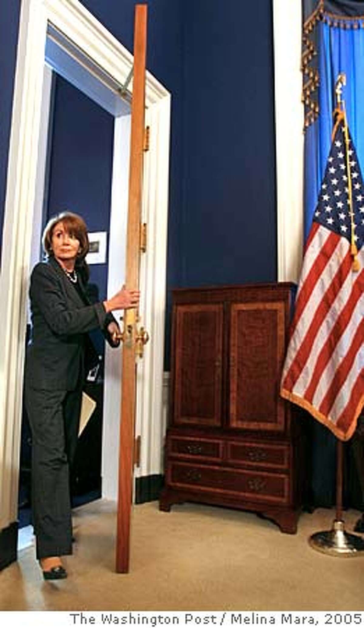 NA/PELOSI LOCATION: WASHINGTON, DC DATE: 12/08/05 NEG: CAPTION: House Minority Leader Nancy Pelosi (D-CA) enters her office before a weekly press conference on Capitol Hill Thursday December 08, 2005. photo by Melina Mara/The Washington Post.