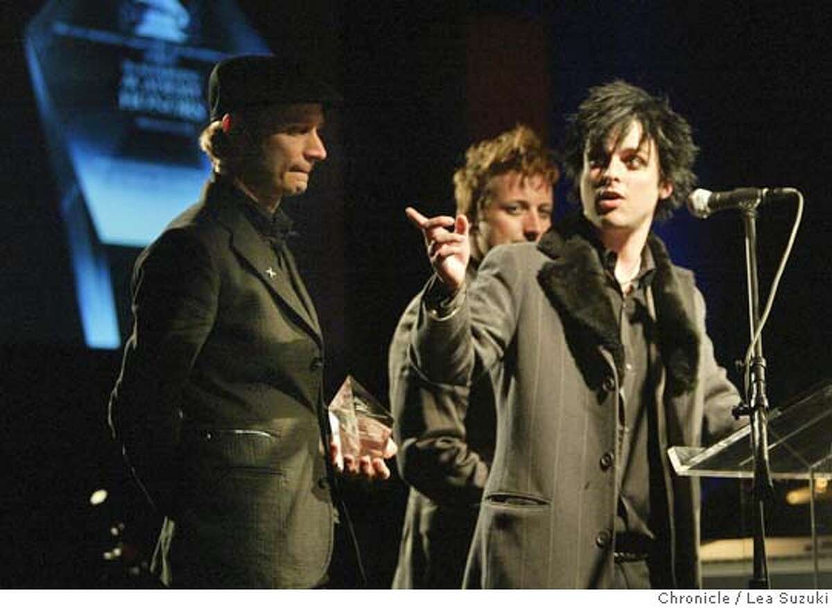 grammy21_087_ls.jpg Green Day (from left: Mike Dirnt, Tre' {accent over the e} Cool and Billie Joe Armstrong) accept their award at the San Francisco Chapter's 2006 Recording Academy Honors. Music luminaries Dave Brubeck,� George Duke, three-time Grammy winners Green Day and the San Francisco Blues Festival have been named as recipients of the San Francisco Chapter's 2006 Recording Academy Honors.�The gala event, which will attract recording artists, key entertainment executives and community leaders, will be held Sunday, March 19, at 6 p.m. in the Grand Ballroom of the historic Westin St. Francis in San Francisco's Union Square. Photo taken on 3/19/06 in San Francisco, CA. Photo by Lea Suzuki/ The San Francisco ChronicleRan on: 03-21-2006 East Bay punk rock trio Green Day accepts a Recording Aca- demy Honors trophy Sunday at the Westin St. Francis Hotel. MANDATORY CREDIT FOR PHOTOG AND SF CHRONICLE/ -MAGS OUT.