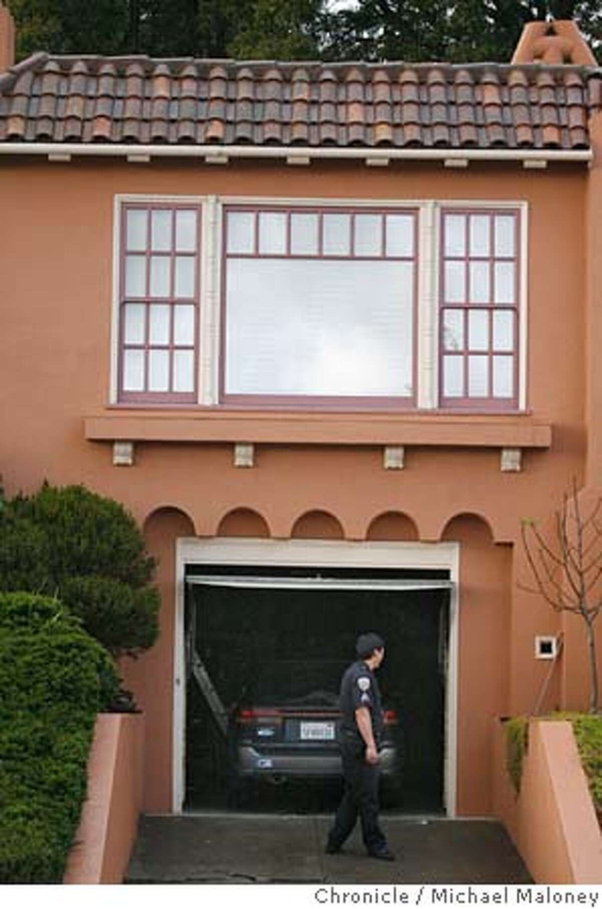 HOMICIDE_040_MJM.jpg A SFPD officer looks into the garage where the homicide occured. A 3-year-old girl is dead and her mother and 3-year-old brother have been taken to hospitals after they were found this afternoon in an SUV inside the garage of a home in Ingleside Terrace section of San Francisco, police said. The mother, age 40, apparently tried to kill both her children and herself, said Lt. John Hennessey, head of the police homicide detail. Her name was not immediately released. The woman apparently lit a barbecue grill inside an SUV in the garage of their home at 370 Moncada Way, Hennessey said. Photo by Michael Maloney / San Francisco Chronicle on 3/29/06 in San Francisco,CA MANDATORY CREDIT FOR PHOTOG AND SF CHRONICLE/ -MAGS OUT