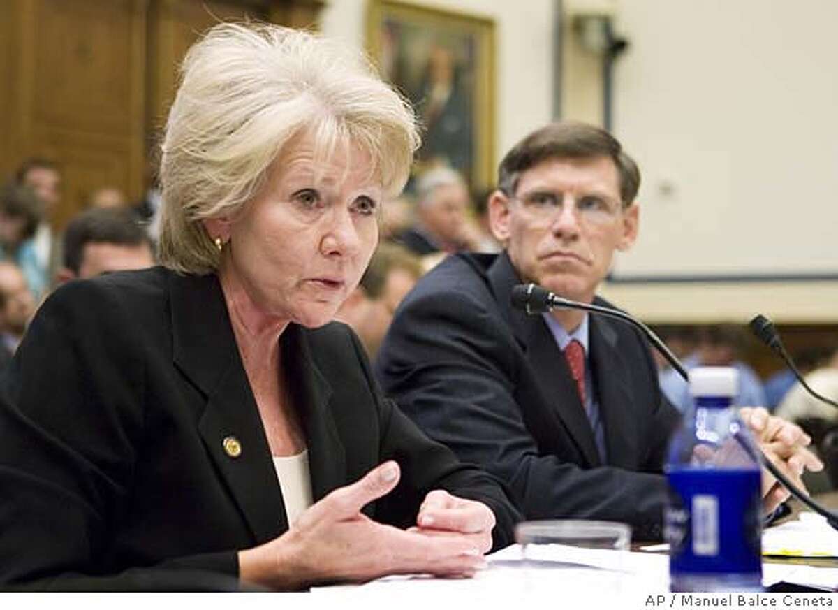 Transportation Secretary Mary Peters, left, accompanied by Federal Highway Administration Administrator Richard Capka, right, testifies on Capitol Hill in Washington, Wednesday, Sept. 5, 2007, before the House Transportation Committee hearing on fixing our nation's structurally deficient bridges. (AP Photo/Manuel Balce Ceneta)