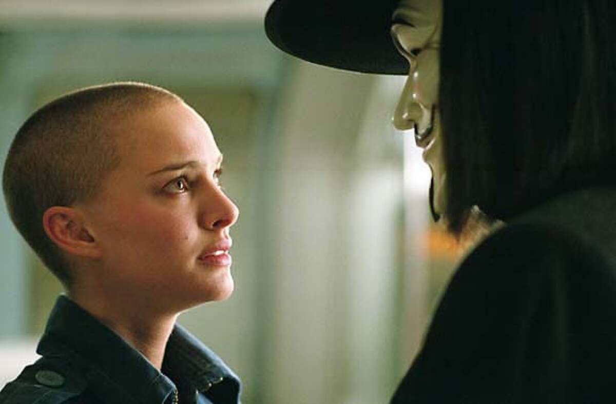 NATALIE PORTMAN as Evey and HUGO WEAVING as V in Warner Bros. Pictures� and Virtual Studios� action thriller �V for Vendetta,� distributed by Warner Bros. Pictures. PHOTOGRAPHS TO BE USED SOLELY FOR ADVERTISING, PROMOTION, PUBLICITY OR REVIEWS OF THIS SPECIFIC MOTION PICTURE AND TO REMAIN THE PROPERTY OF THE STUDIO. NOT FOR SALE OR REDISTRIBUTION.