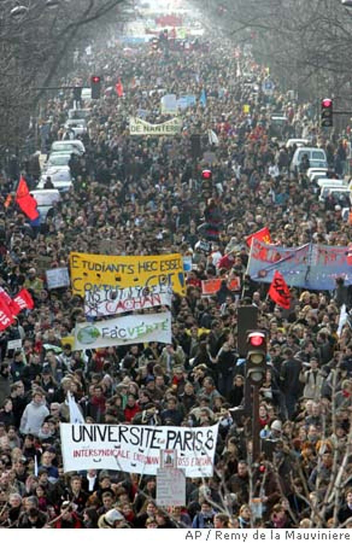 Students and workers march in Paris, France, on Saturday March 18, 2006, during a demonstration against the "First Job Contract", a jobs plan known as CPE.(AP Photo/Remy de la Mauviniere)