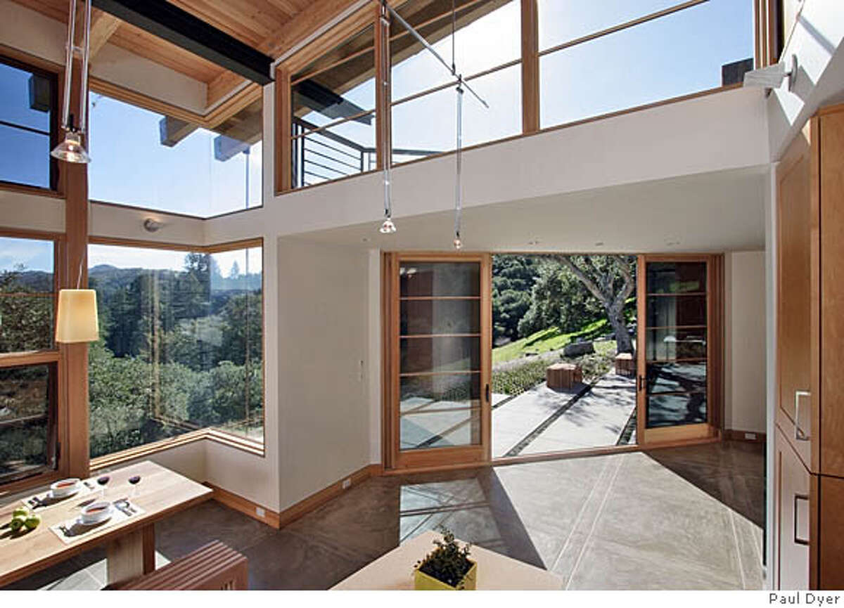 TREADING LIGHTLY ON THE LAND / A modern home honors the timeless beauty