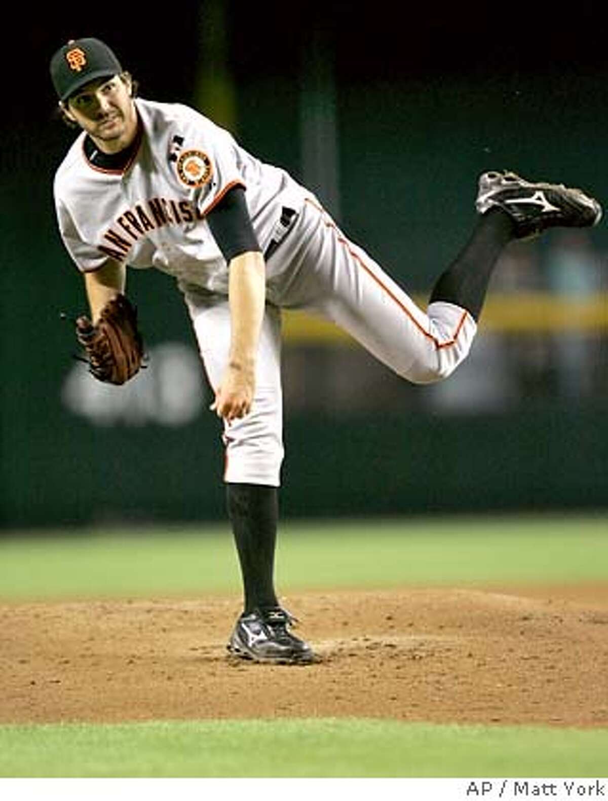 San Francisco Giants pitcher Barry Zito follows through on a pitch against the Arizona Diamondbacks during the first inning of a baseball game Wednesday, Sept. 19, 2007, in Phoenix. (AP Photo/Matt York)