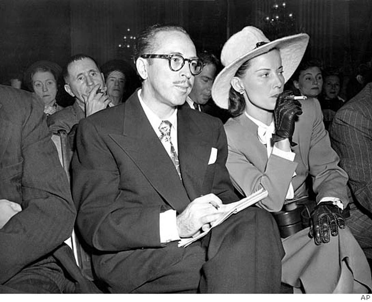 Screenwriter Dalton Trumbo, left, and his wife, Cleo, listen from the audience as the chairman of the House Un-American Activities Committee (HUAC) announces a contempt citation against Trumbo at a hearing in Washington, D.C., Oct. 28, 1947. On the witness stand Trumbo, one of the Hollywood Ten called before the committee, declined to say whether he is or has been a Communist. Trumbo served a prison sentence in 1950 and was blacklisted in the film industry. (AP Photo) Ran on: 03-03-2005 Screenwriter Dalton Trumbo with his wife, Cleo, listens as he is cited for contempt at the house Un-American Activities Committee. Ran on: 03-03-2005 Cable car returns to service after strike.