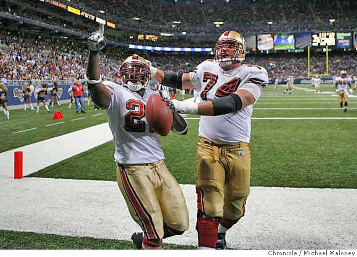 San Francisco 49ers Frank Gore (#21) and San Francisco 49ers Joe Staley (#74) celebrate Gore's 3rd quarter TD. The St Louis Rams host the San Francisco 49ers at Edward Jones Dome on 9/16/07 in St Louis, MO. The SF 49ers won 17-16. Photo by Michael Maloney / San Francisco Chronicle ***roster/code replacement MANDATORY CREDIT FOR PHOTOG AND SF CHRONICLE/NO SALES-MAGS OUT