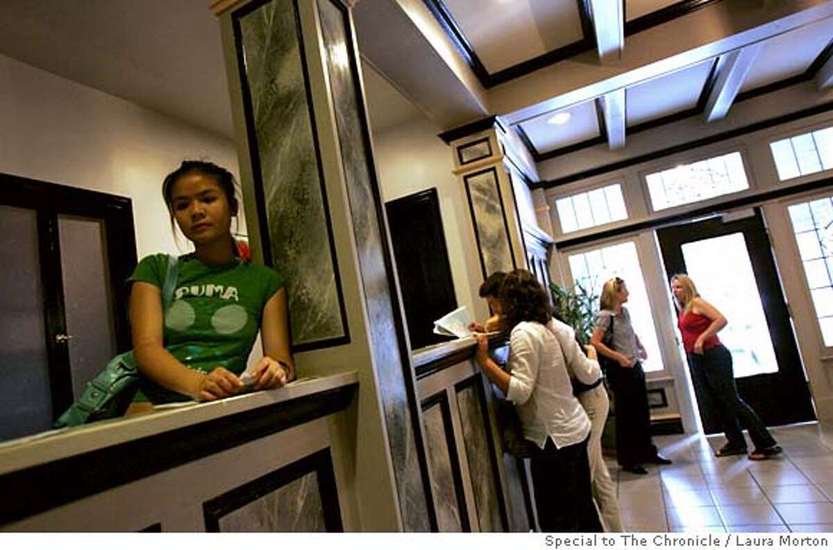 rents08_0032_LKM.jpg Amy Yee (left) waits to view a Nob Hill apartment with several others during an open house. The San Francisco rental market has tightened up recently, making apartments harder to find. (Laura Morton/Special to the Chronicle) *** Amy Yee