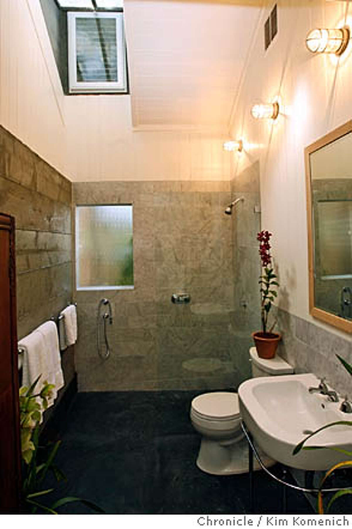 DUPLEX26_0012_KK.JPG Bathroom of rear unit. Note high ceilings and skynights. Architect Malcolm Davis and his partner Brian Lackey own a duplex in the Castro. Originally, the house was being sold as a tear-down, even with plans for a new 3,500 square foot house, included. Davis decided to go a different way, preserving the existing building. What we now have is two one-bedroom units, only about 700 square feet each, but they feel a whole lot bigger because of creative use of space and light. San Francisco Chronicle photo by Kim Komenich 2/21/06 � Copyright 2006 Kim Komenich/San Francisco Chronicle