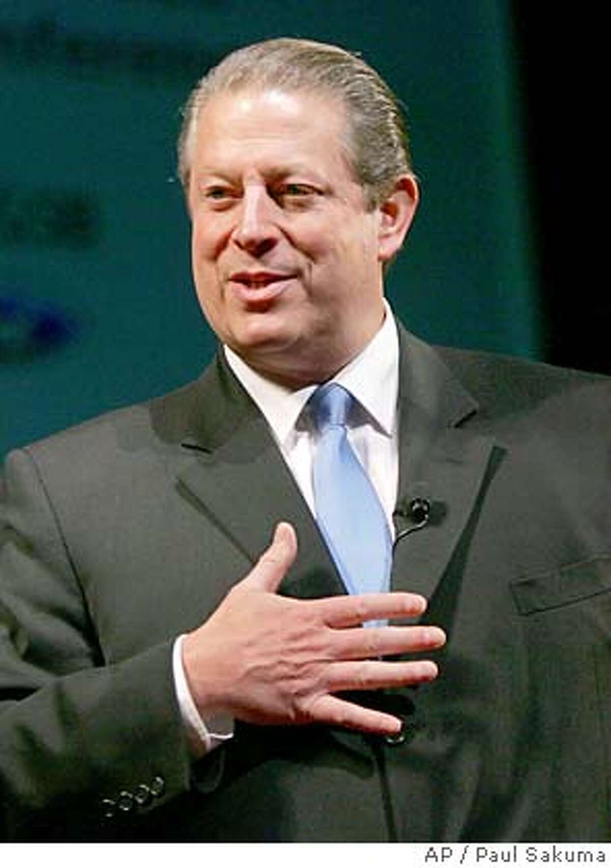 Former Vice President Al Gore gestures during a keynote address to the Net Impact 2005 Conference at Stanford University in Stanford, Calif., Friday, Nov. 11, 2005. Gore is presently chairman of Generation Investment Management. Net Impact 2005 Conference is one of the largest annual gatherings of MBA students in the world. (AP Photo/Paul Sakuma) Ran on: 11-12-2005 Photo caption STAND ALONE PHOTO