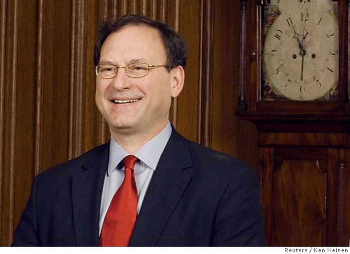 Justice Samuel A. Alito poses for photographers in the Justices' Dining Room at the U.S. Supreme Court in Washington February 16, 2006. REUTERS/Ken Heinen/Supreme Court Pool 0