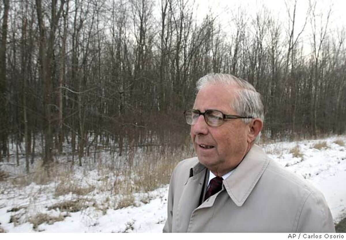 Keith Carabell stands next to his wooded acres in Chesterfield Township, Mich., Friday, Feb. 10, 2006. Carabell has fought nearly two decades to develop the property that regulators say contains legally protected wetlands. The case will go before the U.S. Supreme Court, Tuesday, Feb. 21, 2006, in a showdown that analysts say has far-reaching implications for federal environmental law and could signal whether the high court will veer rightward on environmental issues with the arrival of Justices John Roberts and Samuel Alito. (AP Photo/Carlos Osorio)