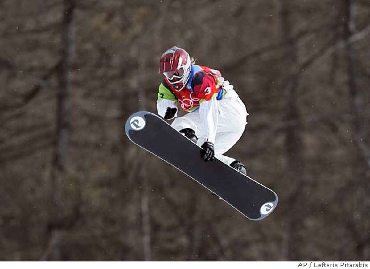 American Lindsey Jacobellis jumps as she leads in the final of the Women's Snowboard Cross competition at the Turin 2006 Winter Olympic Games in Bardonecchia, Italy, Friday, Feb. 17, 2006. Jacobellis crashed in sight of the finish line allowing Tanja Frieden of Switzerland to take the gold medal, Jacobellis finished second to take the silver medal, and Dominique Maltais of Canada bronze. (AP Photo/Lefteris Pitarakis)