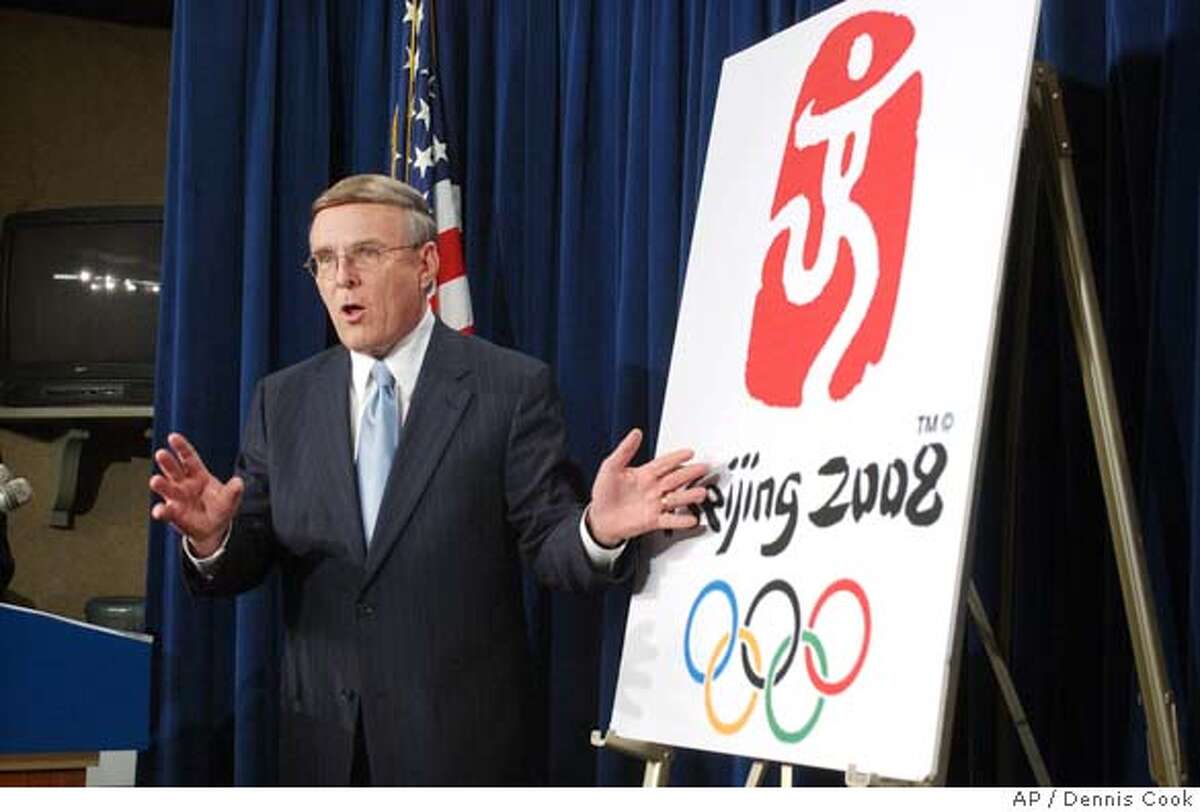 Senator Byron Dorgan, D-N.D., uses China's logo for the 2008 Olympics during a news conference on Capitol Hill Thursday, Feb. 9, 2006, to discuss legislation to repeal China's permanent normal trade relations status with the U. S. (AP Photo/Dennis Cook)