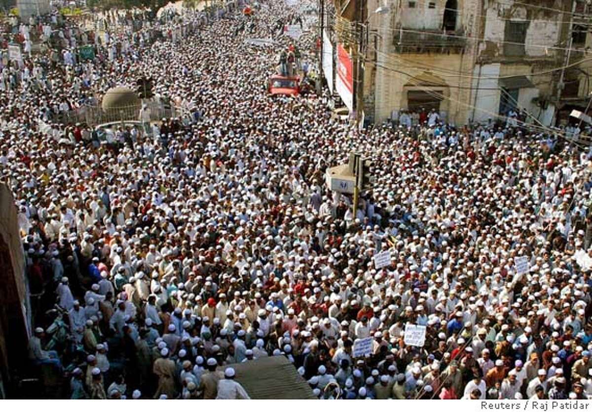 Indian Muslims take part in a silent march during a protest in the central Indian city of Bhopal February 10, 2006. Thousands of Muslims on Friday protested against the cartoons published in European newspapers depicting caricatures of the Prophet Mohammad. REUTERS/Raj PatidarRan on: 02-11-2006 Imam Ahmed Abu Laban speaks at Friday prayers at his mosque in Copenhagen.