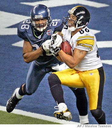 Pittsburgh Steelers running back Jerome Bettis recieves the game ball from  quarterback Ben Roethlisberger after the Pittsburgh Steelers defeat the  Seattle Seahawks 21 to 10 in Super Bowl XL at Ford Field