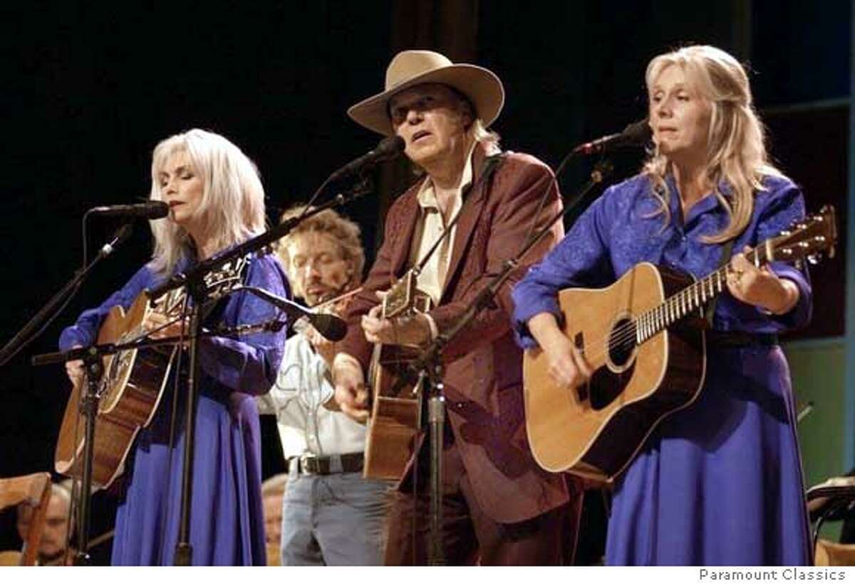 "Heart of Gold" from the Neil Young movie; that's Emmylou Harris on the left; the woman on the right is, I believe, Pegi Young, Neil's wife, Ran on: 02-05-2006 Neil Young, above, survived a brain aneurysm and made two new albums and the film Neil Young: Heart of Gold, below, with his wife, Pegi (right) and Emmylou Harris (left).