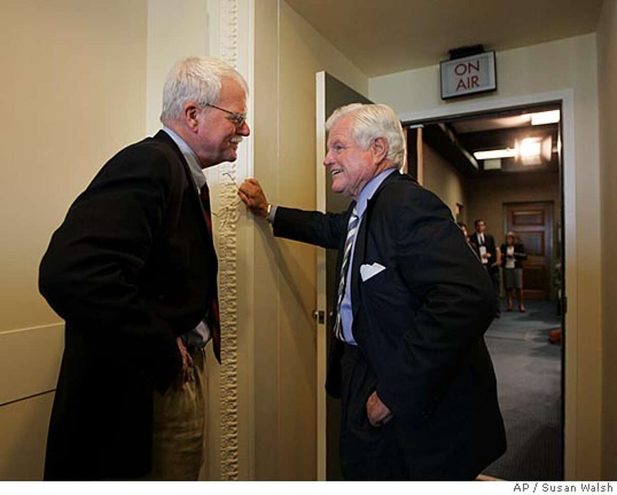 Sen. Edward Kennedy, D-Mass., right, talks with Rep. George Miller, D-Calif., on Capitol Hill in Washington, Friday, Sept. 7, 2007, prior a news conference on higher education. (AP Photo/Susan Walsh)