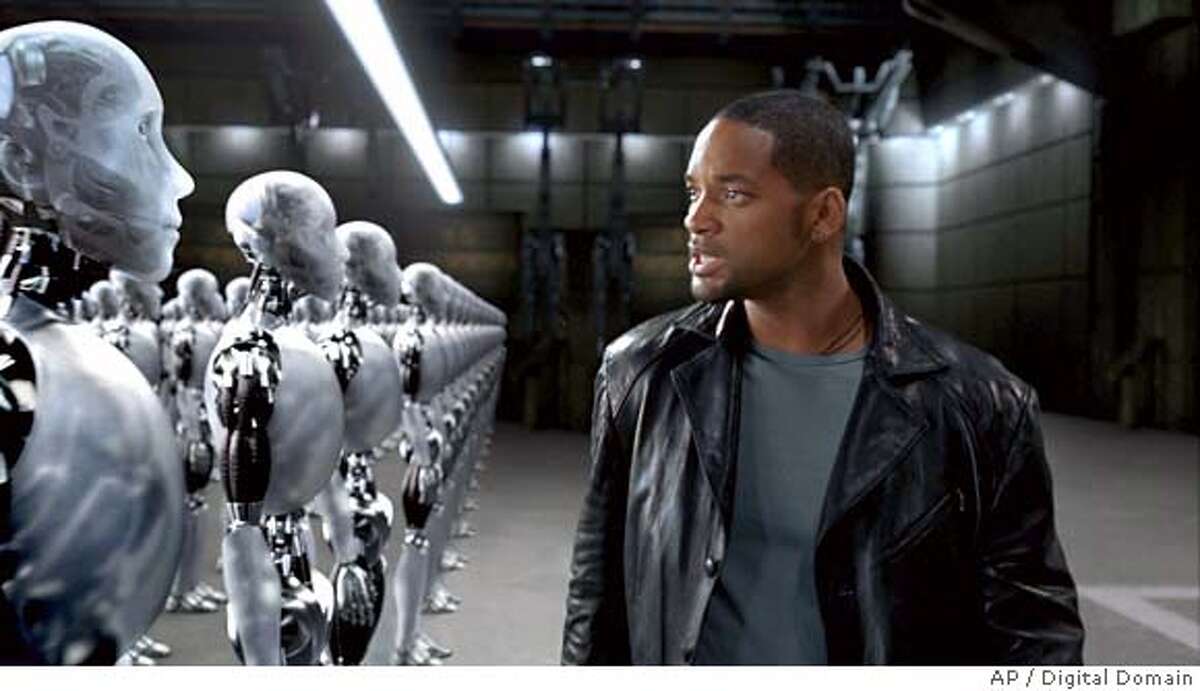 On the hunt for a murderer, Chicago Police Detective Del Spooner (Will Smith) takes a close look at one of several thousand suspects, in "I,Robot." (AP Photo/Digital Domain) Ran on: 07-16-2004 Ran on: 07-16-2004 NO SALES. NO MAGAZINES