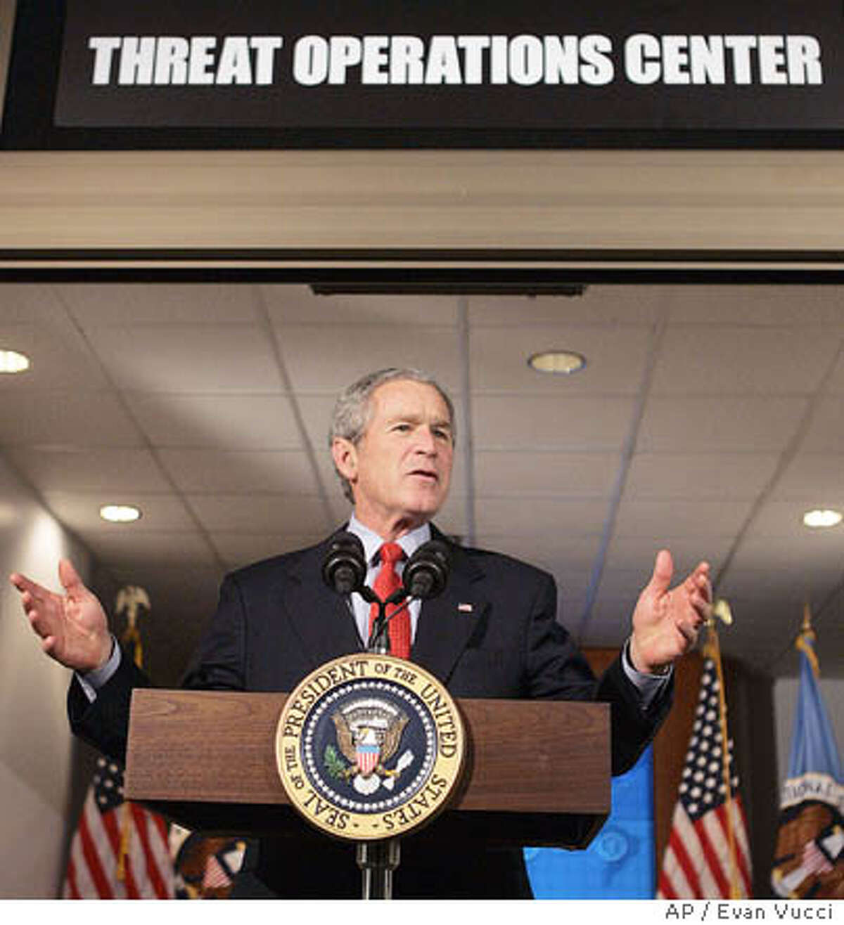 President Bush gestures during a statement at the National Security Agency on Wednesday, Jan. 25, 2006, in Fort Meade, Md. Bush travelled to the heavily-secured site of the super-secret spy agency in suburban Maryland to give a speech behind closed doors and meet with employees in advance of Senate hearings on the much-criticized domestic surveillance. (AP Photo/Evan Vucci)