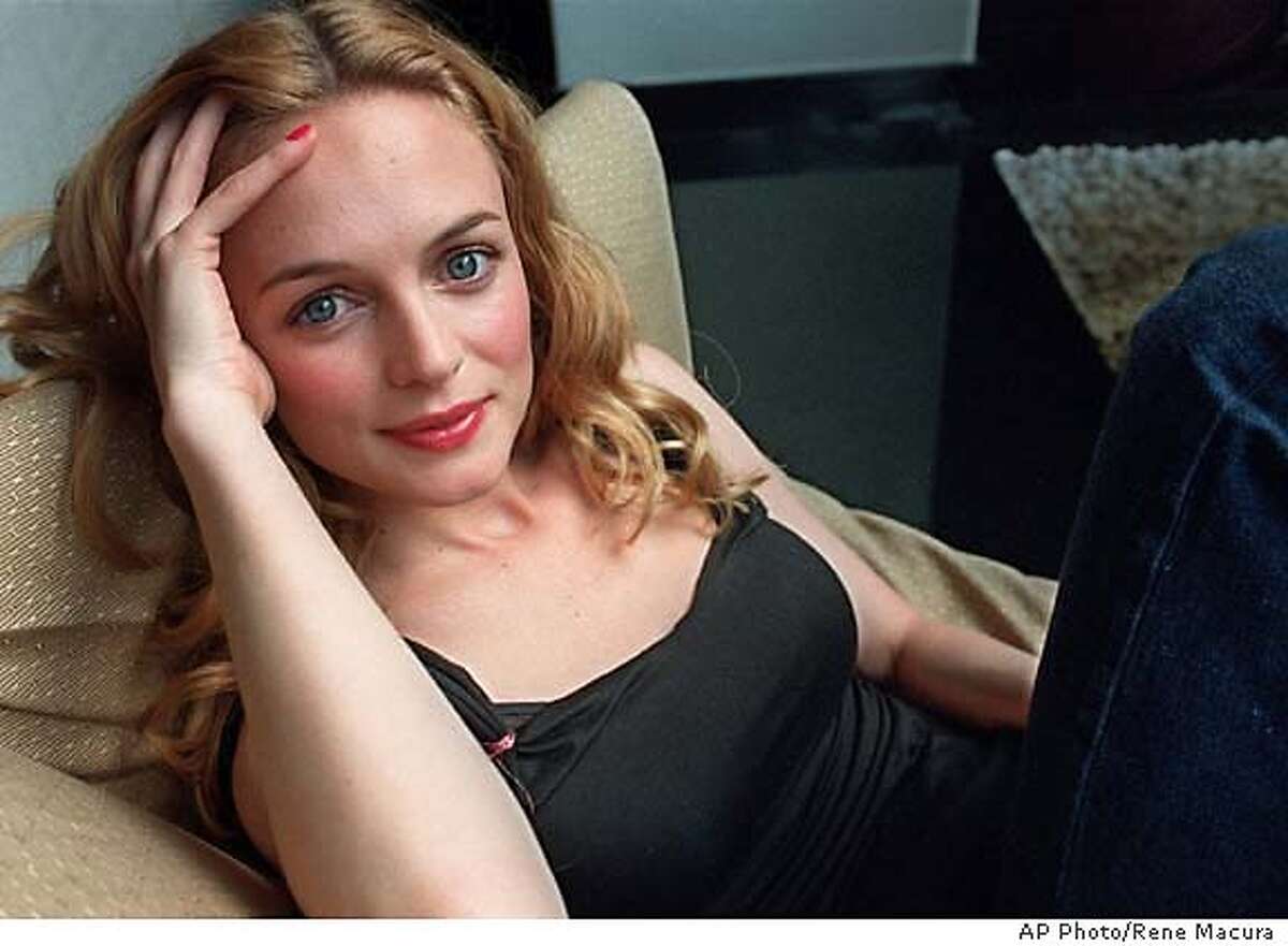 *** FILE *** Actress Heather Graham poses in a Los Angeles hotel April 18, 2000. One minute, Graham was the face of ABC. The next minute, she was gone. Her comedy series "Emily's Reasons Why Not" was promoted relentlessly by the network as the linchpin of its post-football Monday night schedule, but was only given one airing before being yanked earlier this month according to ABC entertainment president Stephen McPherson Saturday Jan. 21, 2006. (AP Photo/Rene Macura) 2000 FILE PHOTO