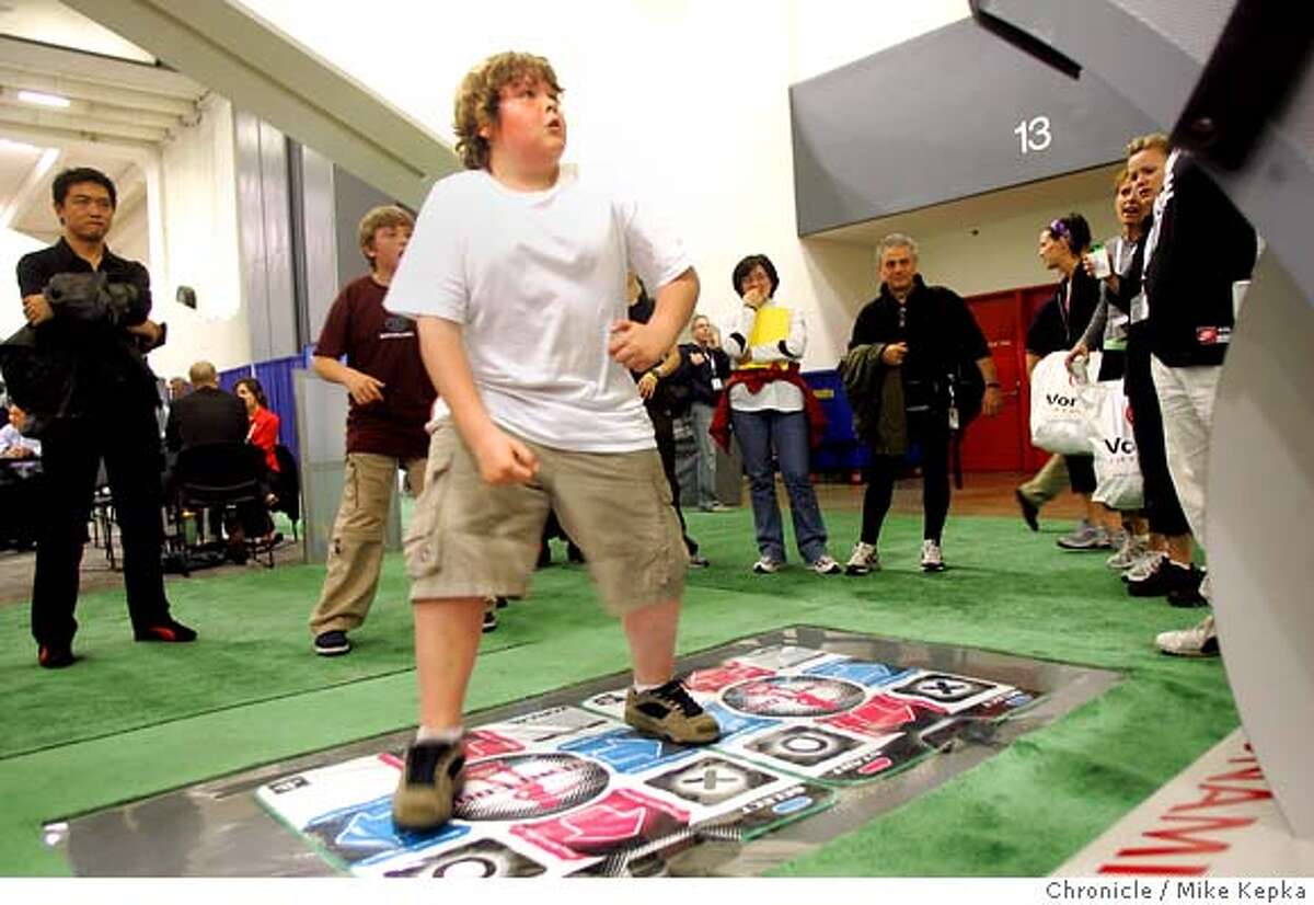 treadmill055_mk.jpg Steven Trothen , 11, of London Onterio, Canada, works out on the dance floor of the fitness game Dance Dance Revolution Extreme which is made by Konami. Fitness fanatics from around the world come to Moscone Center for the International Health and Racquet Sportsclub Association. Mike Kepka / The Chronicle MANDATORY CREDIT FOR PHOTOG AND SF CHRONICLE/ -MAGS OUT