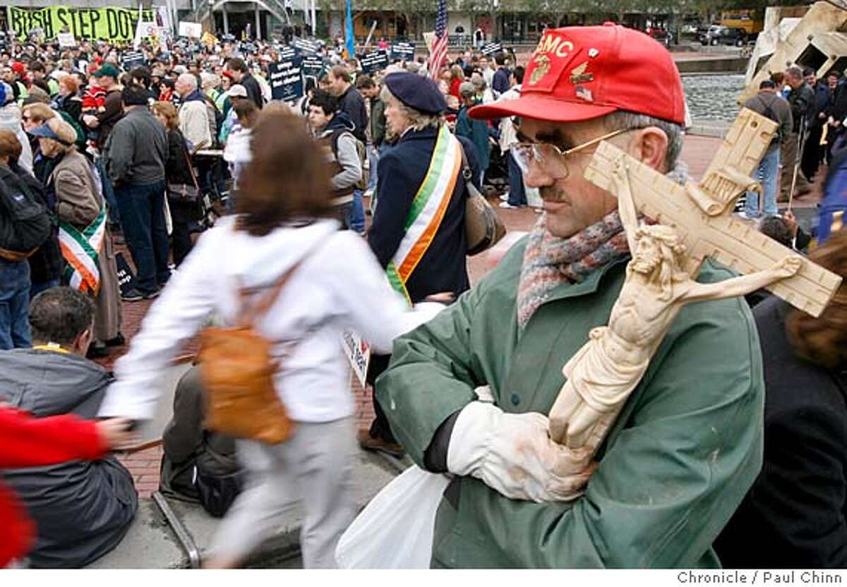 Robert Powers clutches a crucifix as he waits for the second annual Walk For Life anti-abortion march to start in San Francisco, Calif. on 1/21/06. PAUL CHINN/The Chronicle
