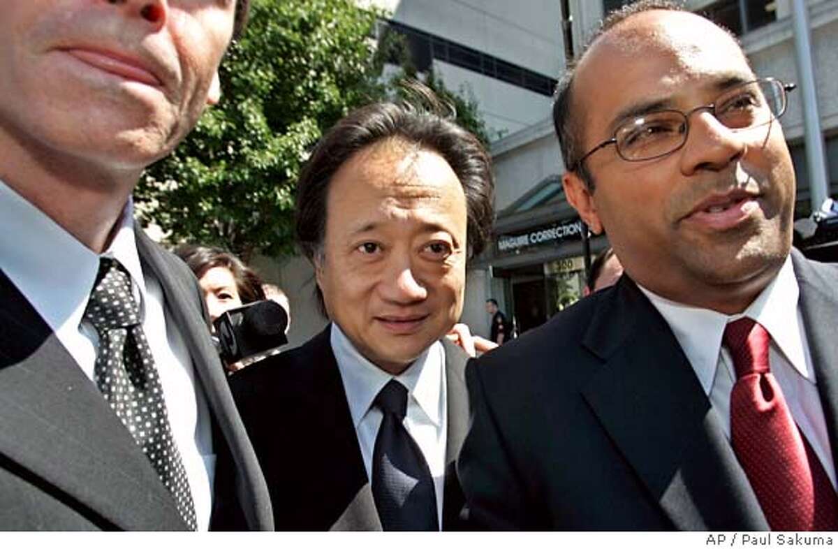 Norman Hsu, center, leaves a San Mateo County jail with Jason Booth, left, and attorney Somnath Raj Chatterjee, right, in Redwood City, Calif., Friday, Aug. 31, 2007. Hsu, a top Democratic fundraiser wanted as a fugitive in California, turned himself in Friday to face a grand theft charge. After reports surfaced this week of Hsu's fugitive status in California, Sen. Hillary Rodham Clinton, (D-NY) joined other candidates in returning thousands of dollars Hsu raised. (AP Photo/Paul Sakuma)
