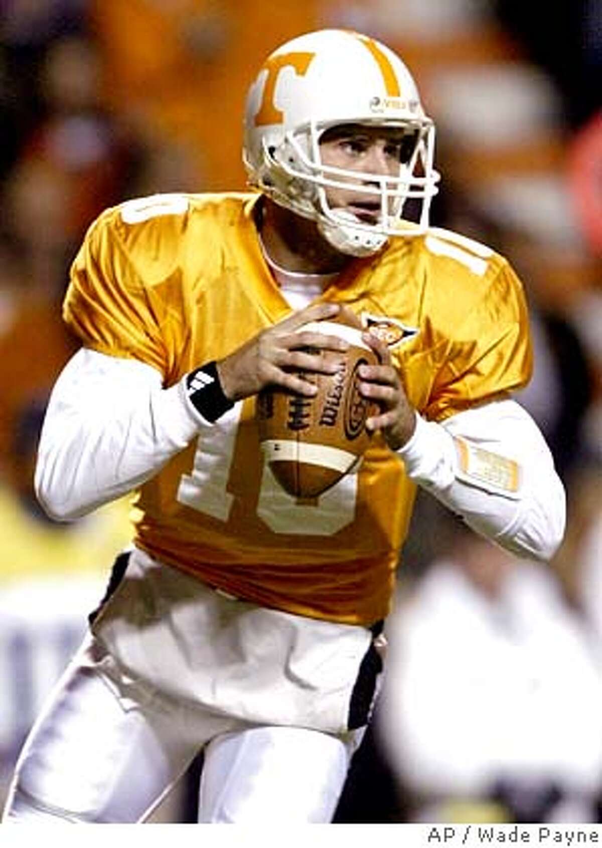** FILE ** Tennessee quarterback Erik Ainge (10) rolls out to pass during their game against South Carolina in this Oct. 29, 2005 file photo, in Knoxville, Tenn. Ainge has a broken pinkie on his throwing hand, but is expected to play Saturday at No. 12 California. (AP Photo/Wade Payne) A OCT. 29, 2005 FILE PHOTO