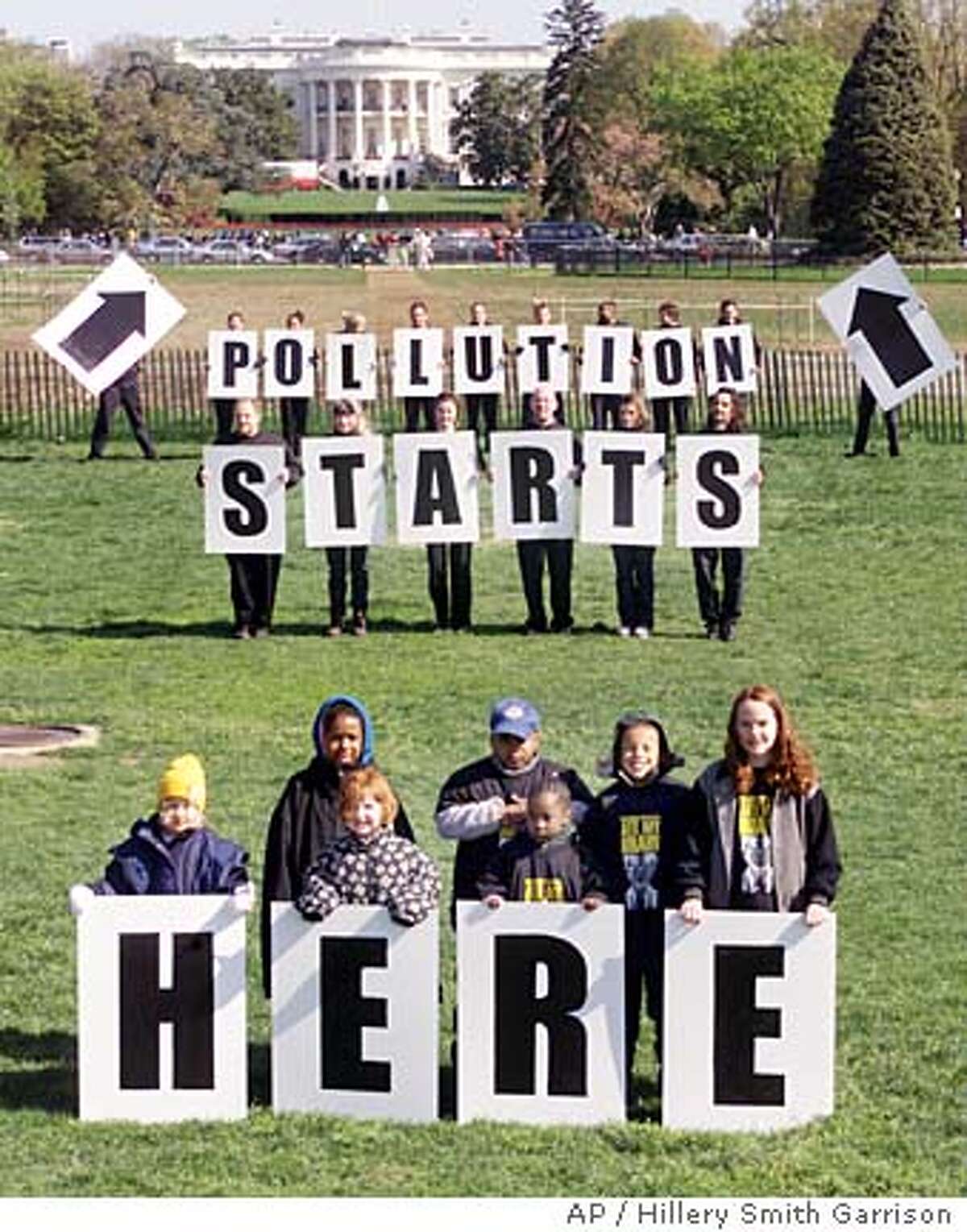 Demonstrators pose for a photo during a Greenpeace rally on the Ellipse in Washington Wednesday, April 18, 2001. Just in time for Eart Day on Sunday, President Bush issued good news to environmentalists. But as this protest shows, it will take far more than that to reassure conservation groups who say they've been steamrolled by a list of industry-friendly actions from the new administration. (AP Photo/ Hillery Smith Garrison) Ran on: 01-08-2006 Environmental activists once favored demonstrations like this Greenpeace rally at the White House, but now many play down grandstanding in favor of shaking hands with enlightened executives.