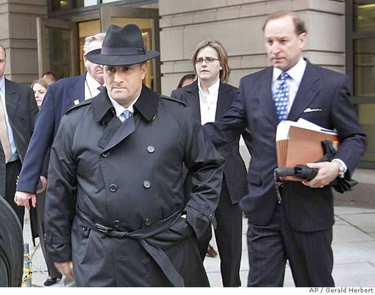 Jack Abramoff, foreground, leaves Federal Court in Washington Tuesday, Jan. 3, 2006. The once-powerful lobbyist pleaded guilty Tuesday to federal charges of conspiracy, tax evasion and mail fraud, agreeing to cooperate with prosecutors investigating influence peddling that has threatened powerful members of the U.S. Congress. At right is his attorney Abbe Lowell. (AP Photo/Gerald Herbert)