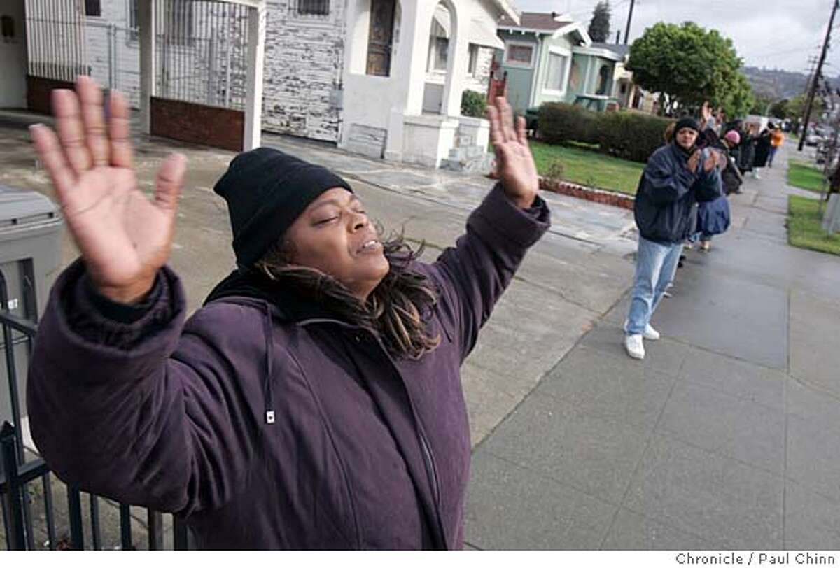chain_051_pc.jpg Eileen Grimes prayed on 104th Avenue when residents, fed up with the homicides in their neighborhoods, formed a human chain around an area they�ve deemed �the killing zone� in Oakland, Calif. on 12/31/05, where most of the city�s murders have occurred. PAUL CHINN/The Chronicle MANDATORY CREDIT FOR PHOTOG AND S.F. CHRONICLE/ - MAGS OUT