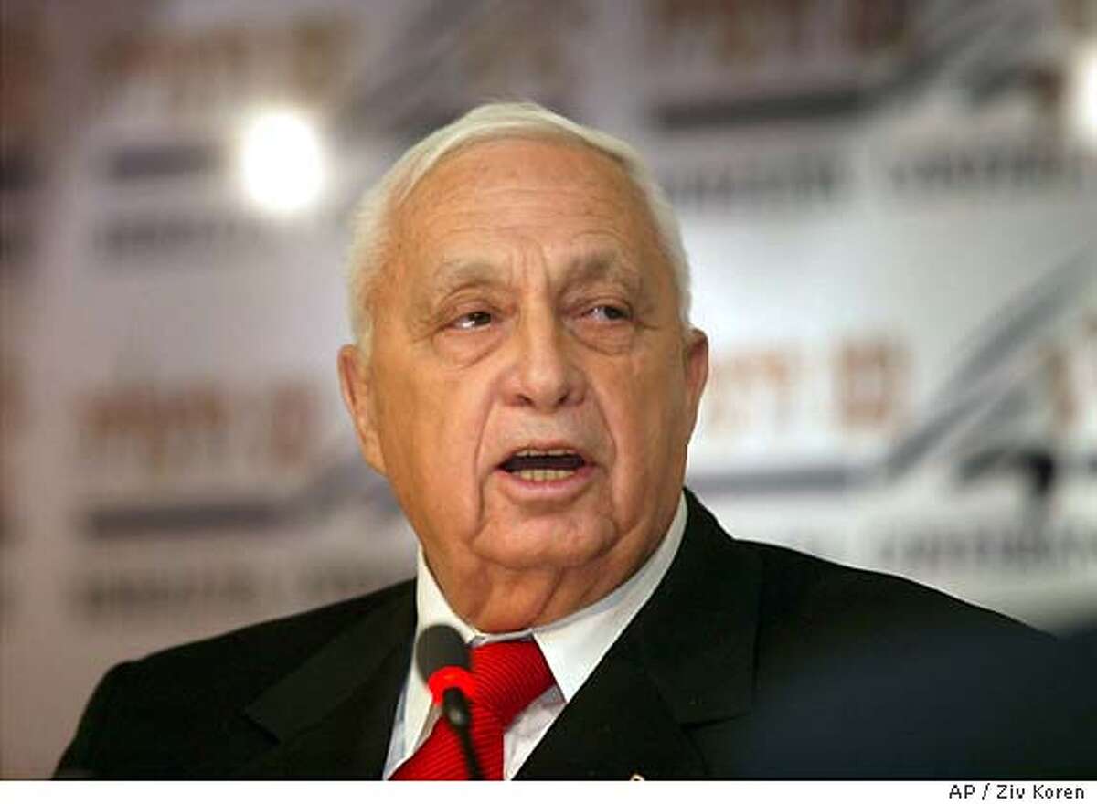 Israeli Prime Minister Ariel Sharon speaks during a convention about security in the Israeli coastal town of Herzliya near Tel-Aviv Thursday Dec. 18, 2003. Sharon said that if the Palestinians do not make moves toward peace within a few months, Israel will begin a process of cutting itself off from them, using a contentious security barrier as part of a makeshift border. He also said his plan would involve relocating some Jewish settlements to provide Israel with the best border for defense. (AP Photo/Ziv Koren/POOL)