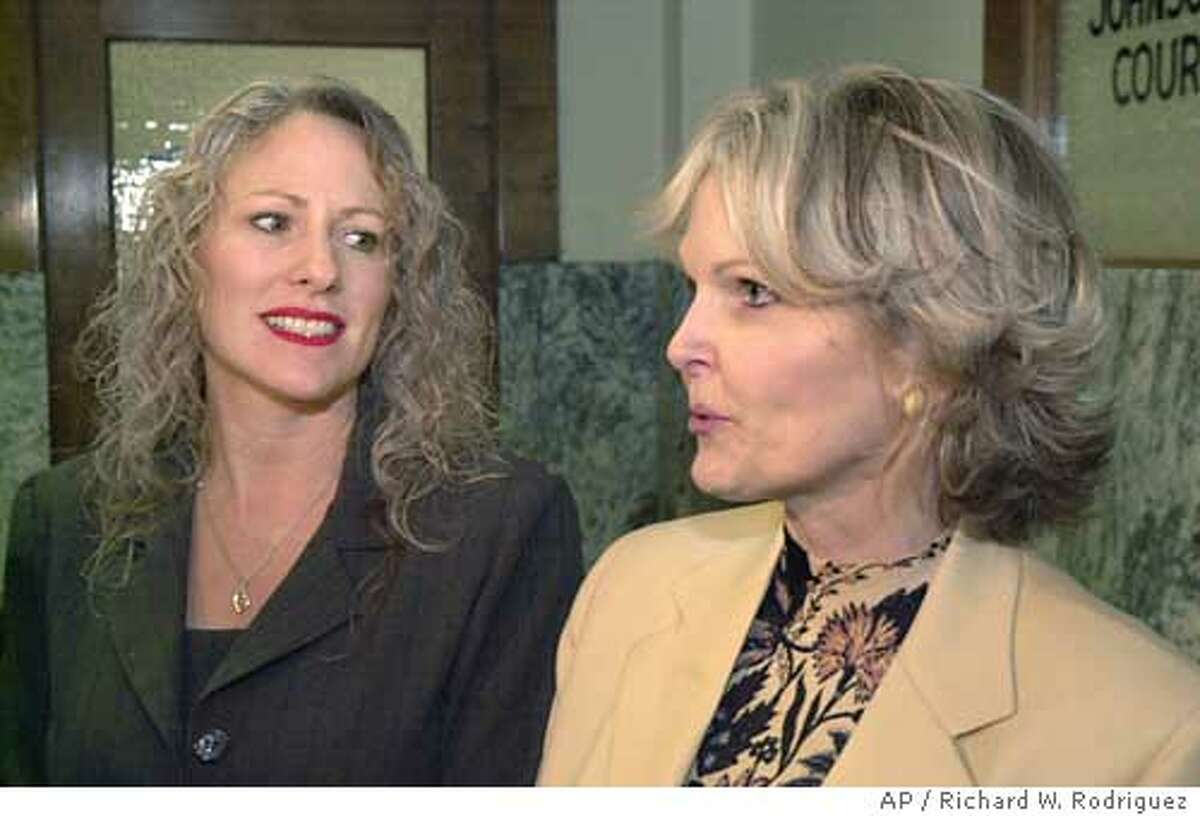 Joanne Webb, left, looks on as her atorney BeAnn Sisemore addresses the media Monday Dec. 15, 2003, at the Johnson County Courthouse in Cleburne, Texas, after a hearing. Webb intended to spice up marriages and earn extra cash by selling erotic toys as one of Passion Parties Inc.'s 3,000 national consultants. Instead, the former fifth-grade teacher and executive board member of the Burleson Chamber of Commerce faces criminal charges and embarrassment after a police sting. Webb made her first court appearance Monday. Judge Robert Mayfield approved a pretrial hearing but did not set a date. (AP Photo/Fort Worth Star-Telegram, Richard W. Rodriguez)