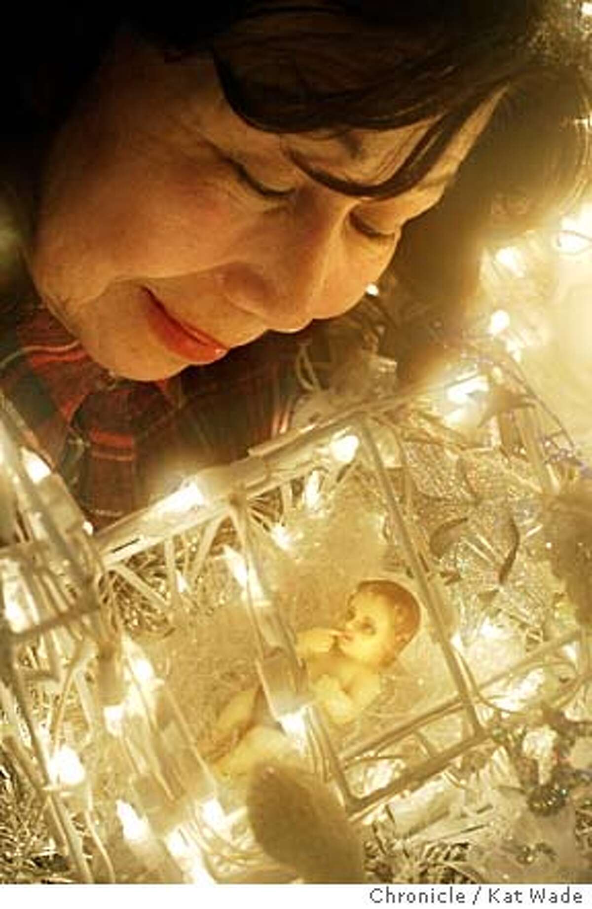 ON 12/8/03 in {city) Rose Orpiano shows off her "Belen" the first piece she collected, a gift from a frind when she visited the Filipine Islands twenty years ago, for her nativity scene, traditional Catholic Filipino Christmas decorations. Kat Wade / The Chronicle MANDATORY CREDIT FOR PHOTOG AND SF CHRONICLE/ -MAGS OUT