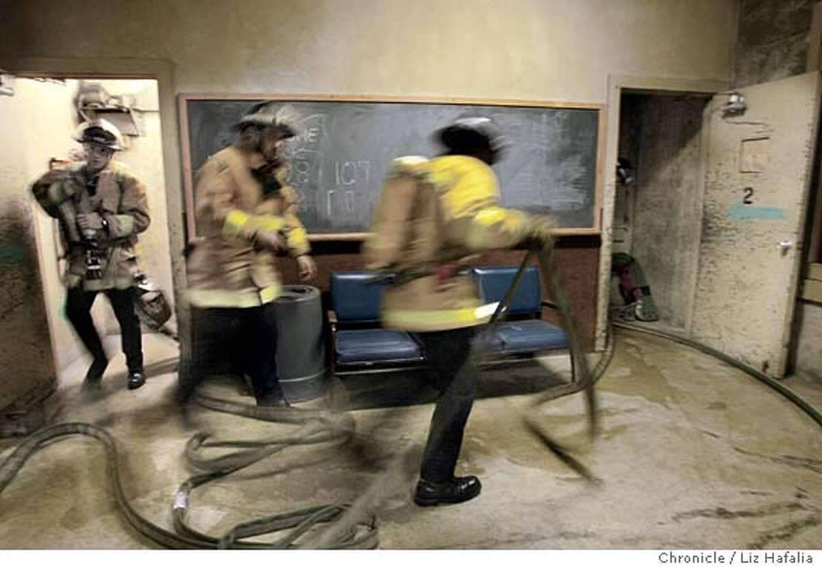 San Francisco Fire Department's Reserve Academy trains reserve firefighters who accompany S.F. Fire Dept. members on emergency runs and fires. Shot on 11/20/03 in San Francisco. LIZ HAFALIA / The Chronicle