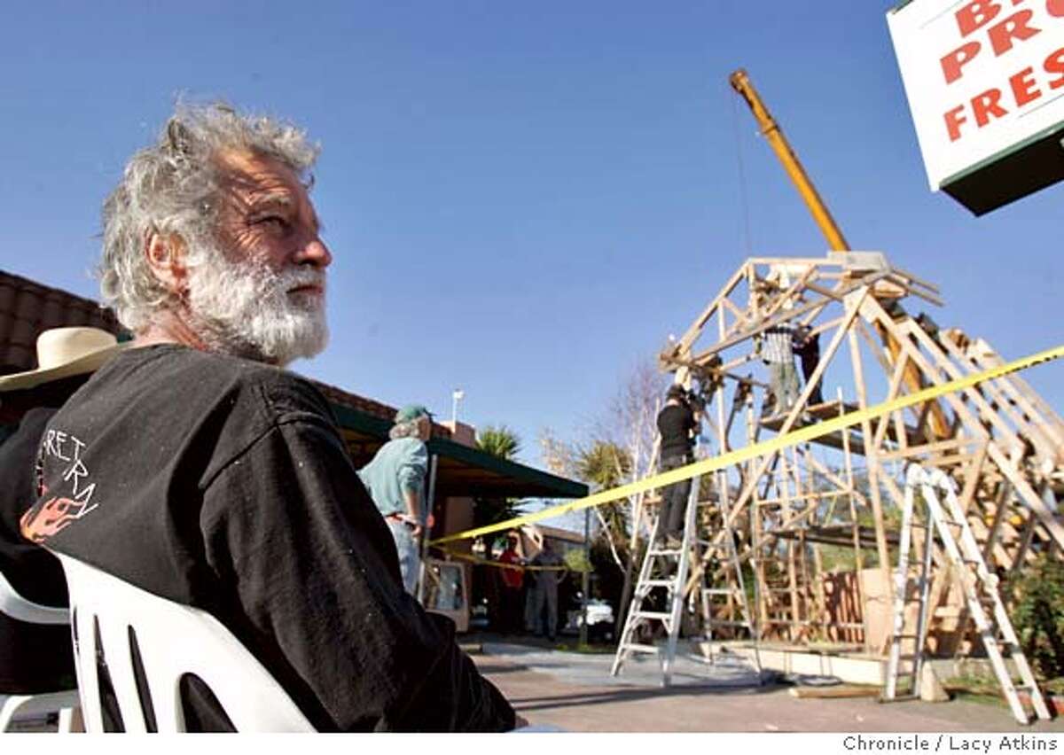 David Best turns away as the workers dismantle the Chapel he built for the day laborers in the Cannel District of San Rafael, Feb.3, 2005. Stop Work was demained by the San Rafael Building Department of David Best's Chapel built for the day laborers in the Canel District, Tuesday Feb. 1, 2005. Petaluma artist David Best, well-known for his Burning Man temples, was commissioned to build a project by the San Rafael Arts Council. He started to build a Chapel of the Laborers for the day laborers in the Canal district and was about two-thirds finished when it got red-tagged by the city yesterday for not being up to building code LACY ATKINS/SAN FRANCISCO CHRONICLE