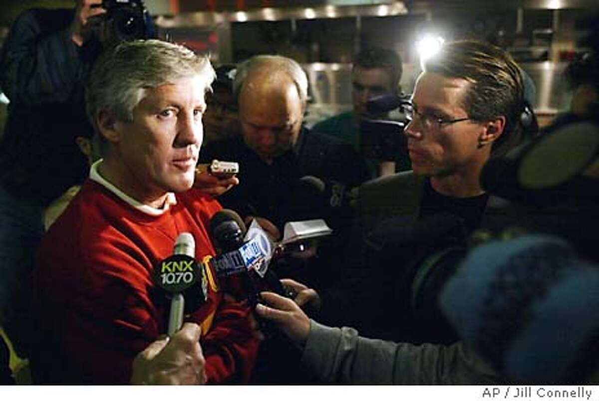 Southern California football coach Pete Carroll talks to the media after they heard the BSC rankings announced at the Galen Center on the USC campus in Los Angeles on Sunday, Dec. 7, 2003. Southern Cal was ranked third, which means they will play in the Rose Bowl instead of the Sugar Bowl. (AP Photo/Jill Connelly) Coach Pete Carroll discusses his teams fate after top-ranked USC didnt qualify for the national title game.