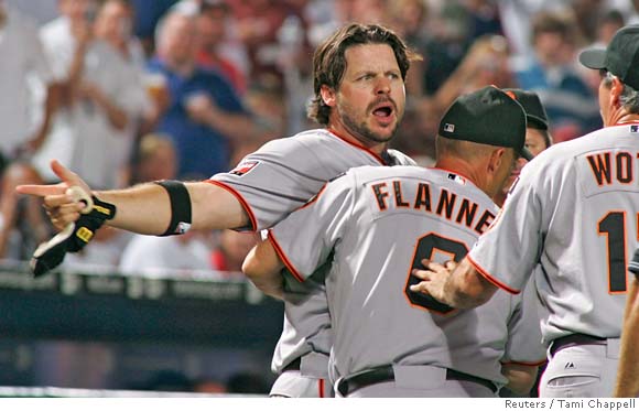 Atlanta Braves' Mark Teixeira, left, celebrates with Kelly Johnson