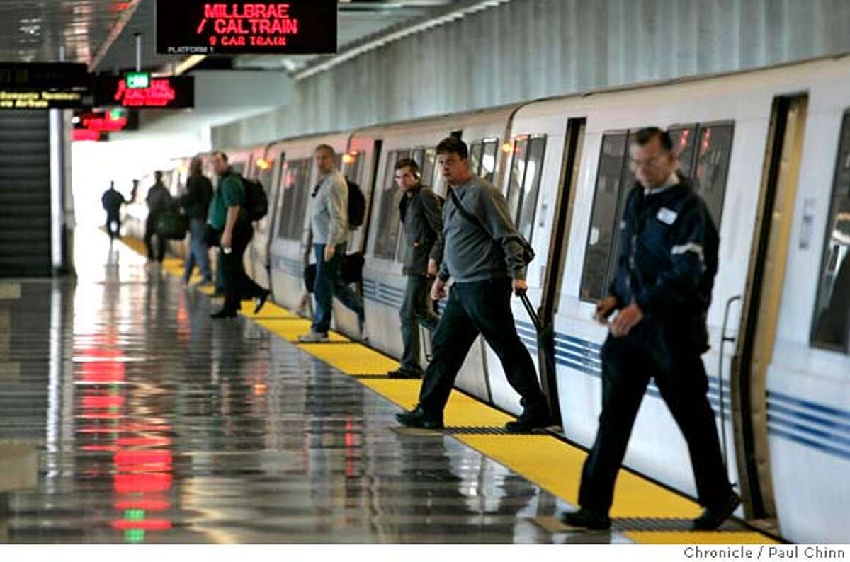 Air travelers exit a train at the SFO BART station in San Francisco, Calif. on Friday, July 7, 2006. Fewer riders are taking advantage of the service than BART officials had hoped for when the service began three years ago despite the convenience of BART's station directly inside the international terminal. PAUL CHINN/The Chronicle MANDATORY CREDIT FOR PHOTOGRAPHER AND S.F. CHRONICLE/NO SALES - MAGS OUT