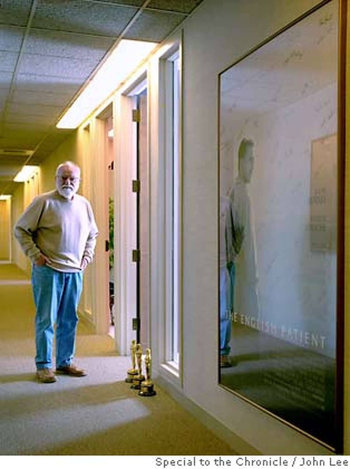 � ZAENTZ_06_JOHNLEE.JPG Three-time Academy Award winning film producer Saul Zaentz (cq), in a hallway of his Berkeley office on July 11, 2007. Next to Zaentz hangs a giant poster of The English Patient, one of the three movies he produced which won in the Academy Awards' best picture category. By JOHN LEE/SPECIAL TO THE CHRONICLE