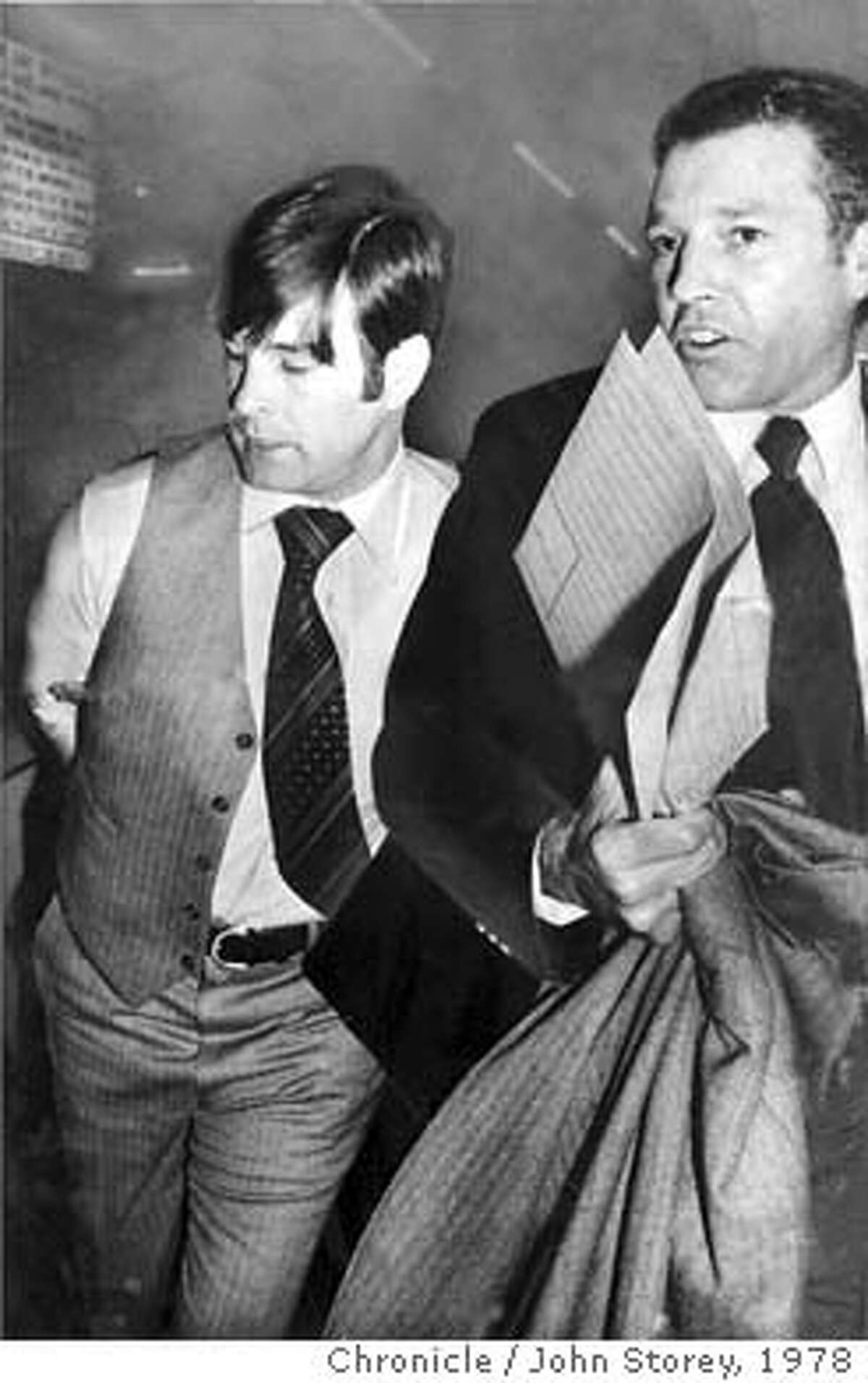WHITE/B/27NOV78/MN/STOREY - Supervisor Dan White, taken into custody by Inspector Howard Bailey, SFPD, in the basement of the Hall of Justice. White was charged with the murder of Mayor George Moscone and Supervisor Harvey Milk. Photo by John Storey CAT