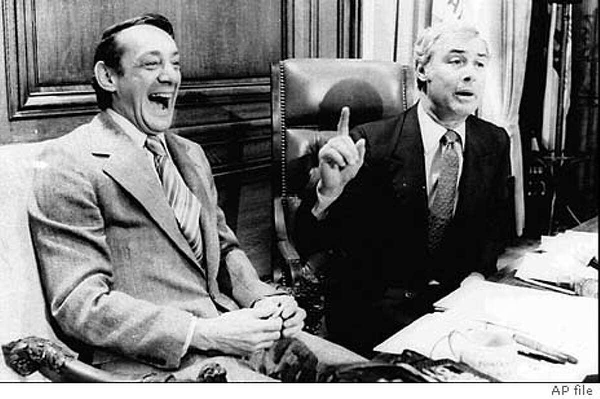 ADVANCE FOR NOV. 27 - FILE - San Francisco Supervisor Harvey Milk, left, and Mayor George Moscone are shown in April 1977 in the mayor's office during the signing of the city's gay rights bill. Friday, Nov. 27, 1998, marks the 20th anniversary of the assassination of Milk and Moscone. (AP Photo/File) ALSO RAN: 12/09/1999
