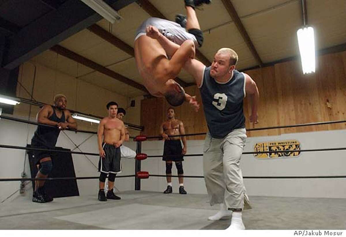 SPORTS / Living the dream at wrestler's school of hard knocks / Novices