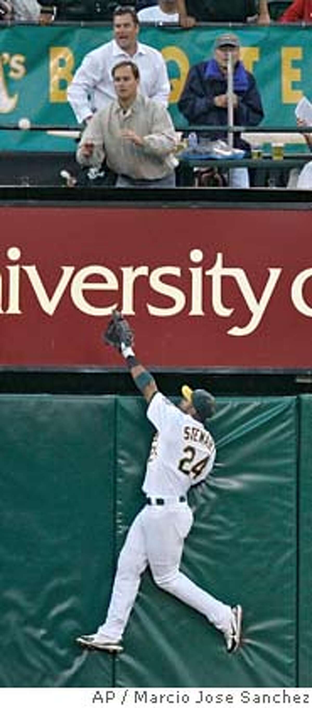 Oakland Athletics left fielder Shannon Stewart fails on a leaping attempt to catch a home run by Los Angeles Angels' Vladimir Guerrero in the fourth inning of a baseball game in Oakland, Calif., Thursday, Aug. 2, 2007. (AP Photo/Marcio Jose Sanchez)