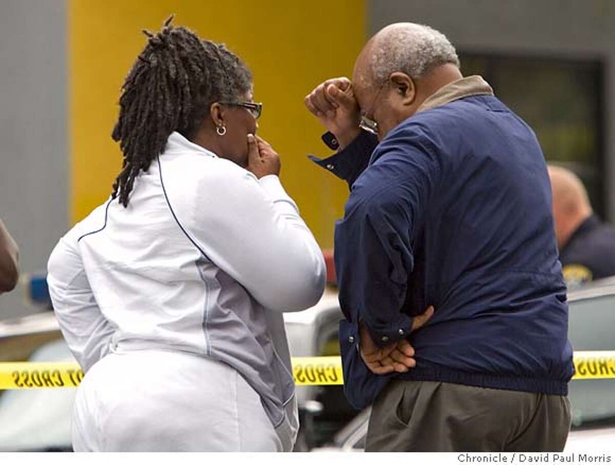 OAKLAND, CA - AUG 2: Paul Cobb (R) the publisher of the Oakland Post grieves as police investigate the homicide of Chauncey Bailey, 58 on August 2, 2007 in Oakland, California. Bailey, the editor of the Oakland Post, was gunned down on 14th street in downtown Oakland in the early morning hours as he was walking to work. (Photo by David Paul Morris / The Chronicle)