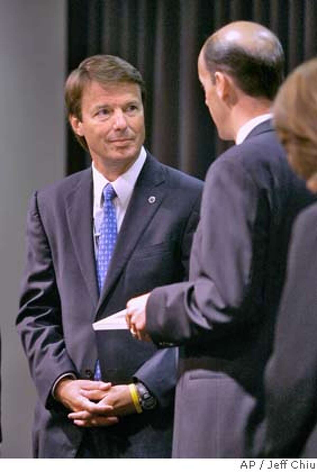 Democratic presidential hopeful John Edwards, left, speaks to members of the Silicon Valley Leadership Group on Wednesday, Aug. 1, 2007, in Santa Clara, Calif. (AP Photo/Jeff Chiu)