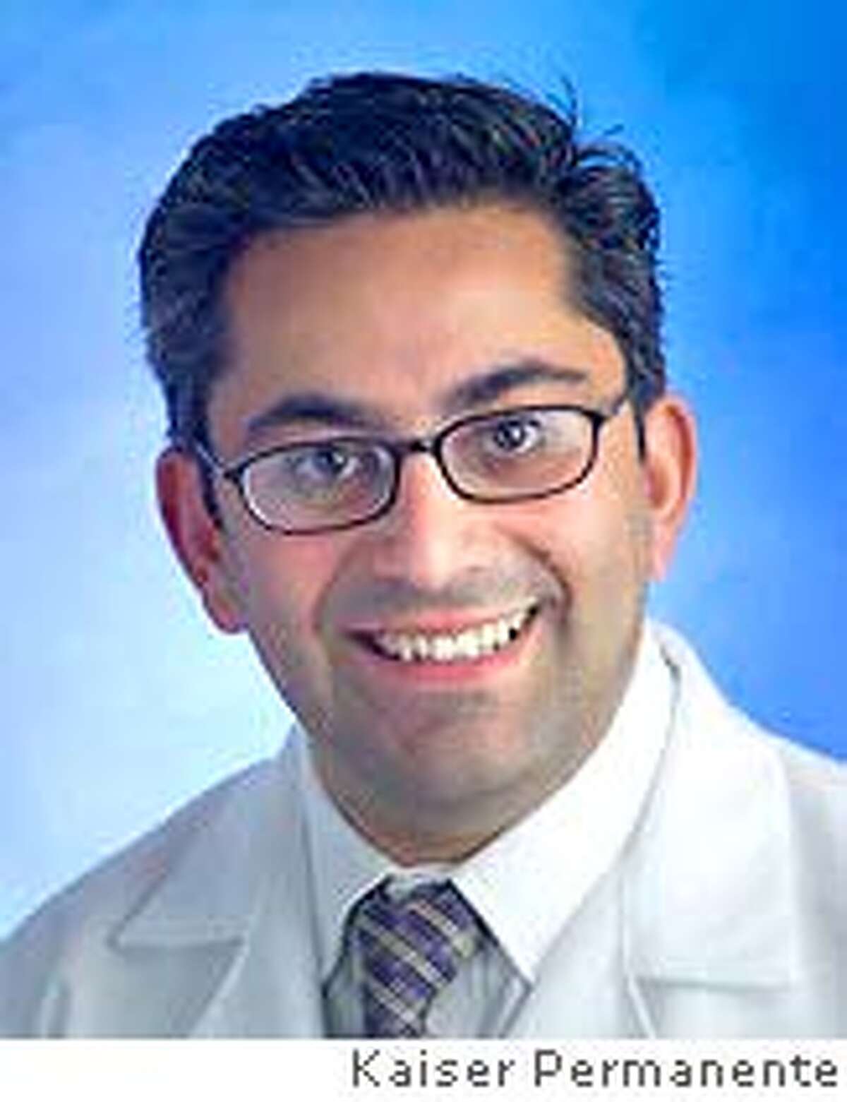 This undated photo released by Kaiser Permanente shows Dr. Hootan Roozrokh, 33, of San Francisco, who is accused of prescribing excessive drugs to a disabled patient to speed up his death and harvest his organs. Roozrokh was charged Monday, July 30, 2007, in the first such criminal case against a transplant doctor in the U.S., the San Luis Obispo county district attorney's office said. (AP Photo/Kaiser Permanente) **NO SALES**
