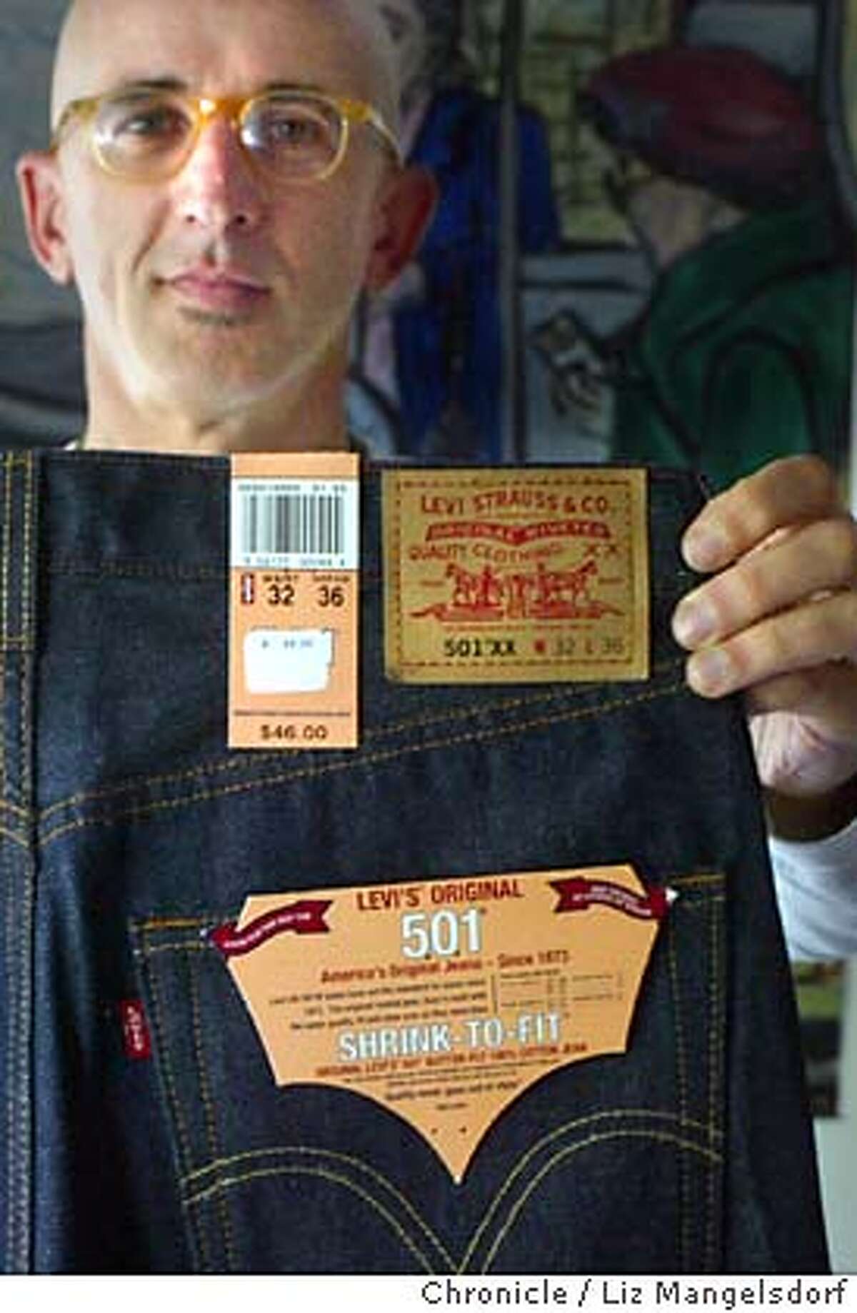 levis30039_LM.jpg Event on 10/29/03 in San Francisco. David Weissman, a longtime Levi's 501 customer, who is upset by the company changing the fit of they 501 jeans, holds up one of the new pair of 501XX jeans. The label on the 501XX jeans, which also have a different pocket stitching. LIZ MANGELSDORF / The Chronicle