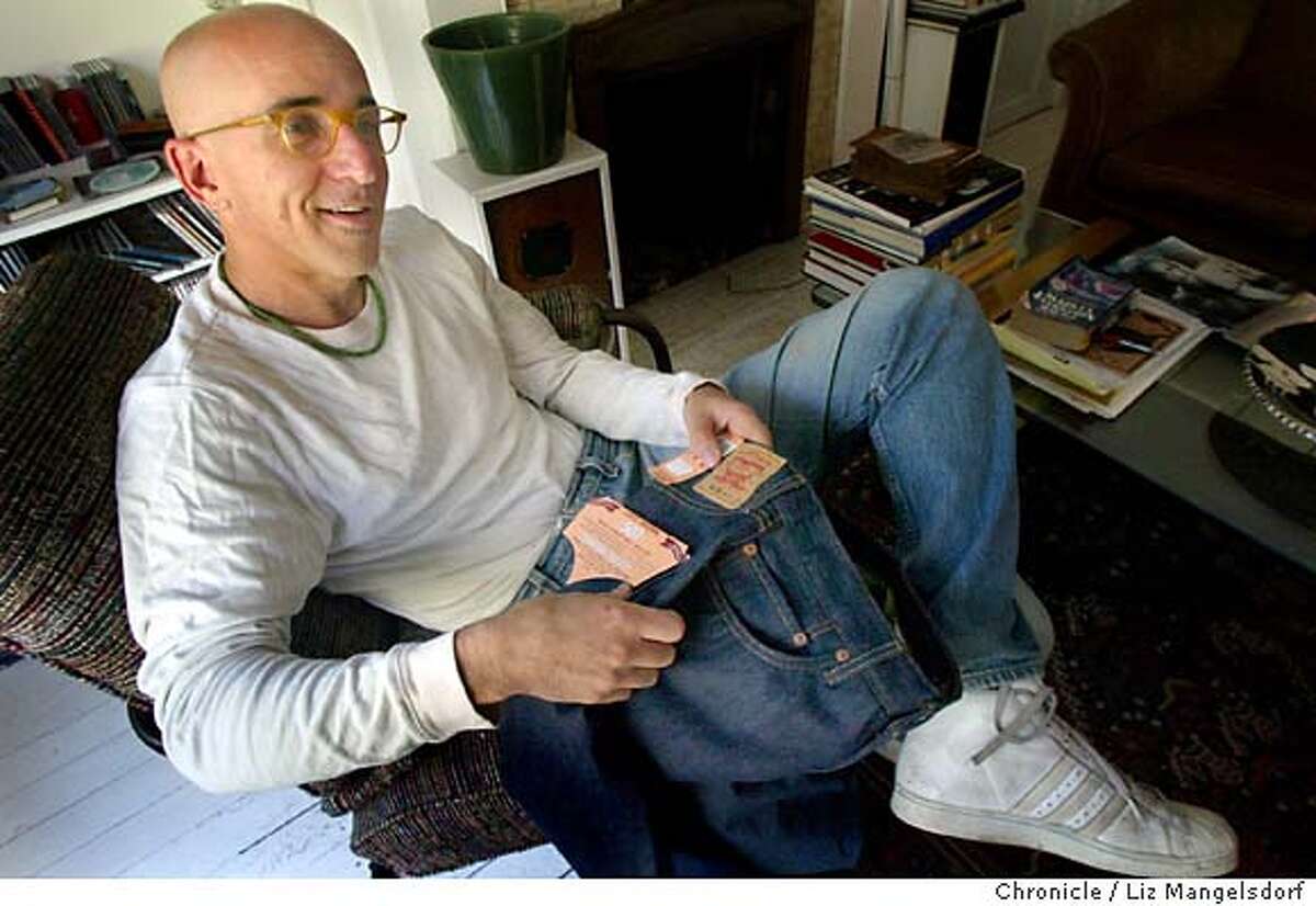 levis30025_LM.jpg Event on 10/29/03 in San Francisco. David Weissman, a longtime Levi's 501 customer, who is upset by the company changing the fit of they 501 jeans, looks over a new pair of levi's 501XX. He is wearing one of his old 501 jeans that he has had for about 4 years. The label on the 501XX jeans, which also have a different pocket stitching. LIZ MANGELSDORF / The Chronicle